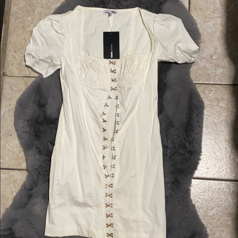 It was sold on the website as white dress.